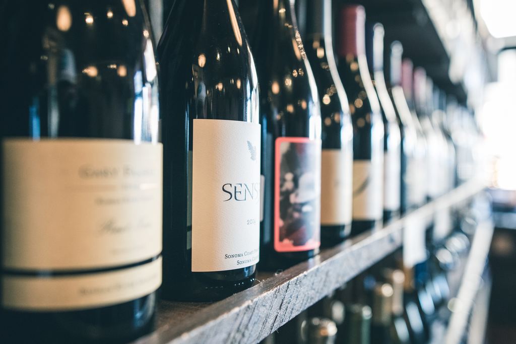 Wine bottles displayed on a retail shelf