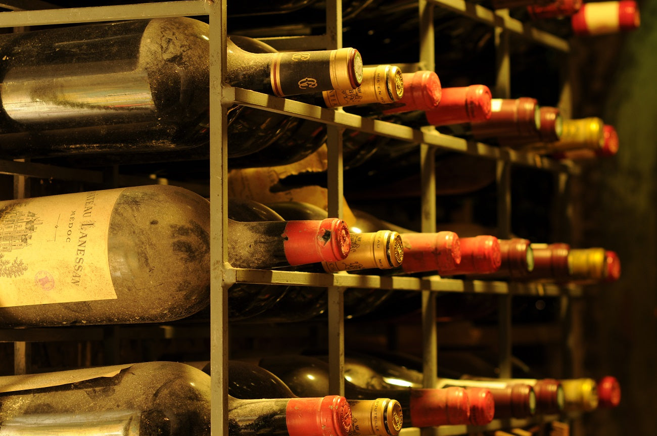 Vintage wine bottles stored in a restaurant cellar