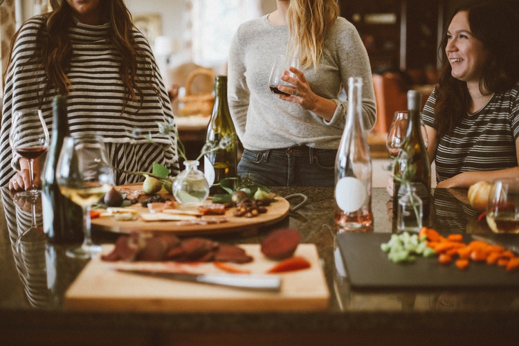 Friends sharing Spanish food and wine at a table