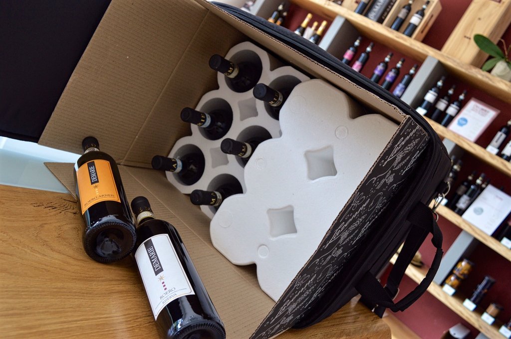 Wine Check travel case packed with bottles at a wine shop