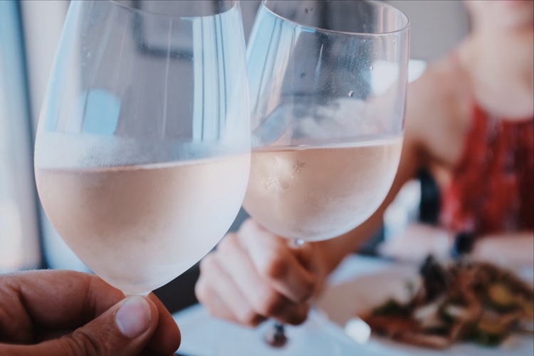 Friends toasting glasses of rosé